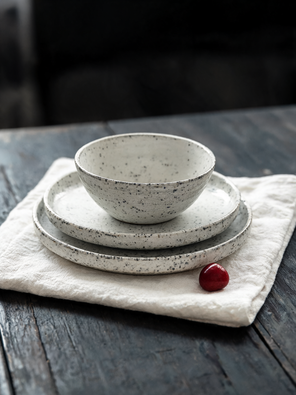 Speckled artisan ceramic plates and bowls, Nordic minimal